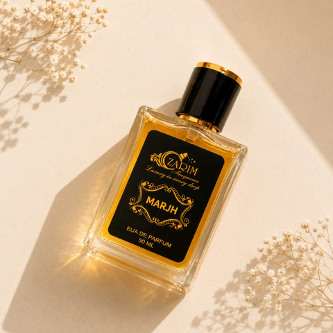 Perfume bottle with gold and black design on a light background