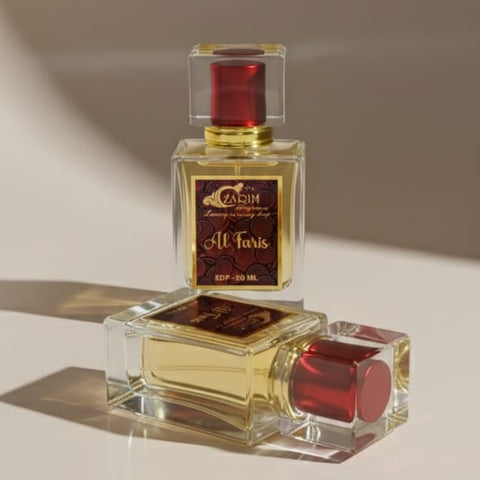 Two perfume bottles with red caps and clear glass bodies on a neutral background