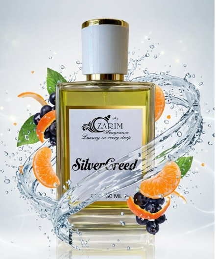 Perfume bottle labeled 'Silver Creed' with fruit elements on a light background